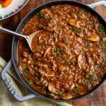 Baked salmon with herbs and walnuts salsa